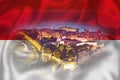 Monaco. Prince palace and old town on the hill in Monaco on Monegian flag overlay view Royalty Free Stock Photo