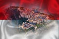 Monaco. Prince palace and old town on the rock in Monaco on Monegian flag overlay view Royalty Free Stock Photo