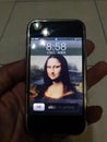 Monalisa smile with iphone 1st generation Royalty Free Stock Photo