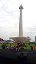 A man who is singing in the monas tourist area. the event is held every afternoon with a small stage
