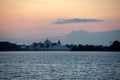 Monastery across the river at sunset Royalty Free Stock Photo