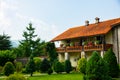 Beautiful old buildings decorated with flowers near the monastery church somewhere far in the mountains of montenegro, religion Royalty Free Stock Photo