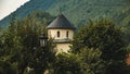 A landscape with a church looking out from the trees against a background of mountains, somewhere in Montenegro, a trip to Europe Royalty Free Stock Photo