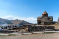 Armenia, Lake Sevan, September 2021. An ancient Christian temple among the mountains and clouds.