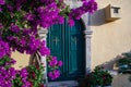 Monastery in Paleokastritsa, Corfu. Door and bougainvillea Royalty Free Stock Photo