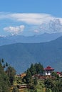 A monastery on the highs over Punakha, and Himalayas peaks Royalty Free Stock Photo