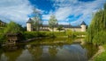 Monastery in Sucevita on shore of pond, Romania Royalty Free Stock Photo