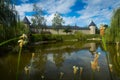 Monastery in Sucevita on shore of pond, Romania Royalty Free Stock Photo