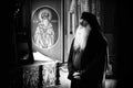 Monastic life of the hermit old monks in the orthodox church in Roumania , priest praying in solitude