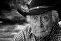 Old cowboy against a stormy sky Royalty Free Stock Photo