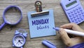 Monday Blues Phrase on Sticky Note with Clock and Calculator Royalty Free Stock Photo