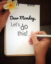 Monday inspirational message - Dear Monday, Lets do this. Writing self motivational note on notebook concept.