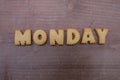 Monday text composed with cookie letters over a wooden board