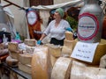 MONDONEDO, SPAIN - AUGUST 14, 2022: Imported gourmet cheese at the medieval fair counter in the old town Mondonedo,Lugo,Galicia,