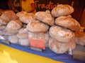 MONDONEDO, SPAIN - AUGUST 14, 2022: Traditional galician wheat bread at the medieval fair counter in the old town Mondonedo,Lugo,