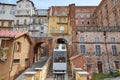 Mondovi, Funicular train and ancient buildings in a sunny summer day in Italy