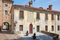 Old building with fresco with cross in a sunny summer day, blue sky in Mondovi, Italy