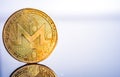 Monero coin in closeup shot on white backround. MoneroXMR cryptocurrency.