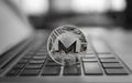 Monero coin symbol on laptop, future concept financial currency, crypto currency sign. Blockchain mining. Digital money