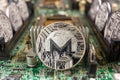 Monero coin on a technology circuit