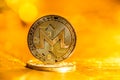 Monero cryptocurrency on a gold background