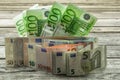 monetary currency on wooden background, Euro banknotes