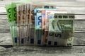 monetary currency on wooden background, Euro banknotes