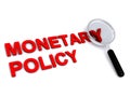 Monetary policy with magnifying glass on white Royalty Free Stock Photo