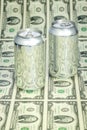 Money and aluminum beverage containers Royalty Free Stock Photo