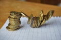 Money background of falling pile of coins as a symbol of financial deterioration