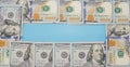 Money background. hundred dollar bills on blue. Copy space.