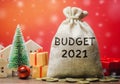 Money bag Budget 2021, Christmas tree, houses and gifts. Accumulating money and planning a budget. Business and finance. Loan,
