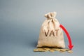 Money bag with coins and down arrow. Reduced VAT and tax burden. Improving the competitiveness of goods and services. Tax relief. Royalty Free Stock Photo