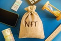 Money bag NFT - non-fungible token. Digitally represented product or asset. Selling digital assets and art through auctions.