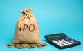 Money bag with the word IPO Initial public offering; stock market launch and a calculator. The first public sale of shares of a Royalty Free Stock Photo