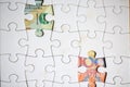 Money behind the puzzle discoverable Royalty Free Stock Photo