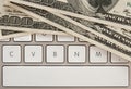 Money bills on computer keyboard with spacebar
