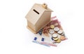 Money box house with euro money, savings or mortgage concept Royalty Free Stock Photo