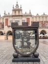 Money-box at the Main Market Square in Krakow Royalty Free Stock Photo