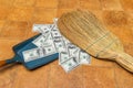 Money and broom