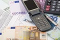 Money, calcolator, graph and mobile telephone Royalty Free Stock Photo
