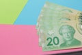 Money from Canada: Canadian Dollars. Bills on colorful bright table