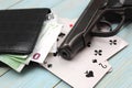 Money cards and gun on black background Royalty Free Stock Photo