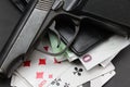 Money cards and gun on black background Royalty Free Stock Photo