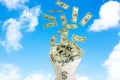 Money cash falling from the sky to the bag with dollars ,sky with clouds background,success concept Royalty Free Stock Photo