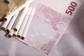 Money and cigarettes Royalty Free Stock Photo