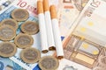 Money and cigarettes Royalty Free Stock Photo
