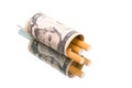 Money and cigarettes on a white background with reflection Royalty Free Stock Photo