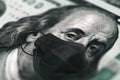 Money closeup of american hundred dollar bills with face mask . Business, Crisis and finance concept