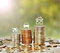 Money coin stack growing graph with icon travel car and house Royalty Free Stock Photo